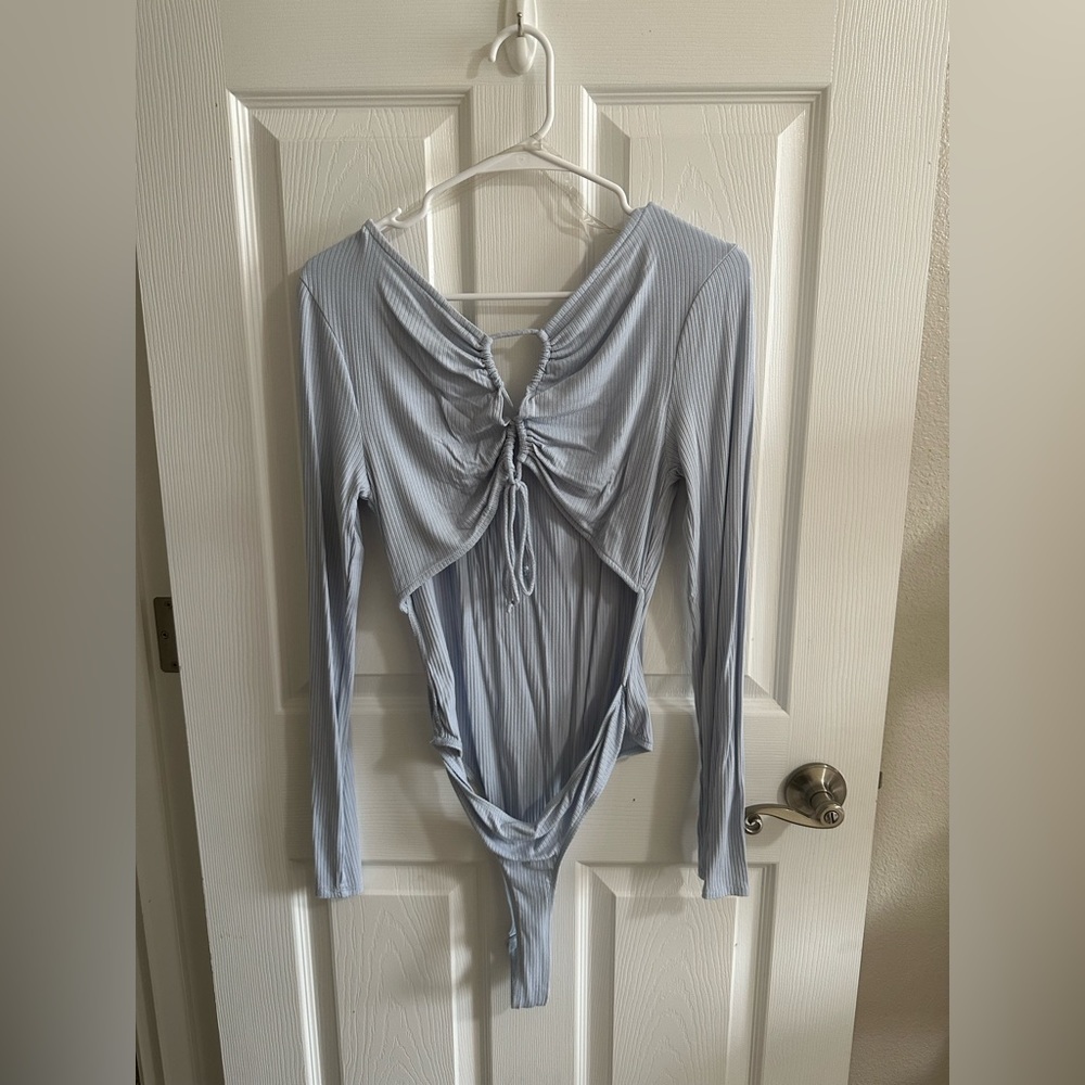 Cut out body suit. Baby blue